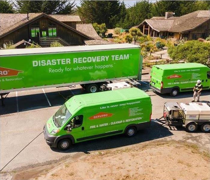 disaster recovery team trailer and two promaster vans with pressure washers