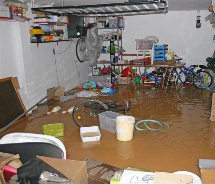 Flood Damaged Garage with floating items in water