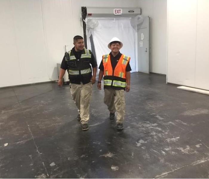 SERVPRO Project Managers Walking A Job Site