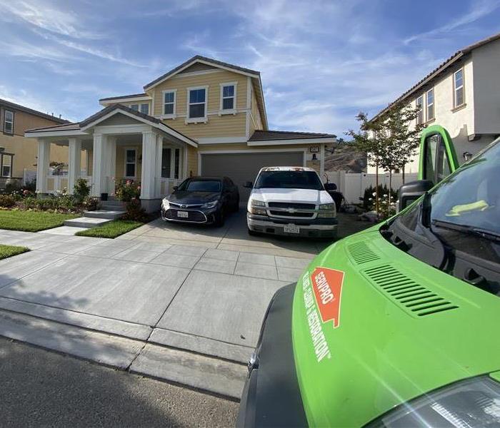 SERVPRO truck parked outside a home